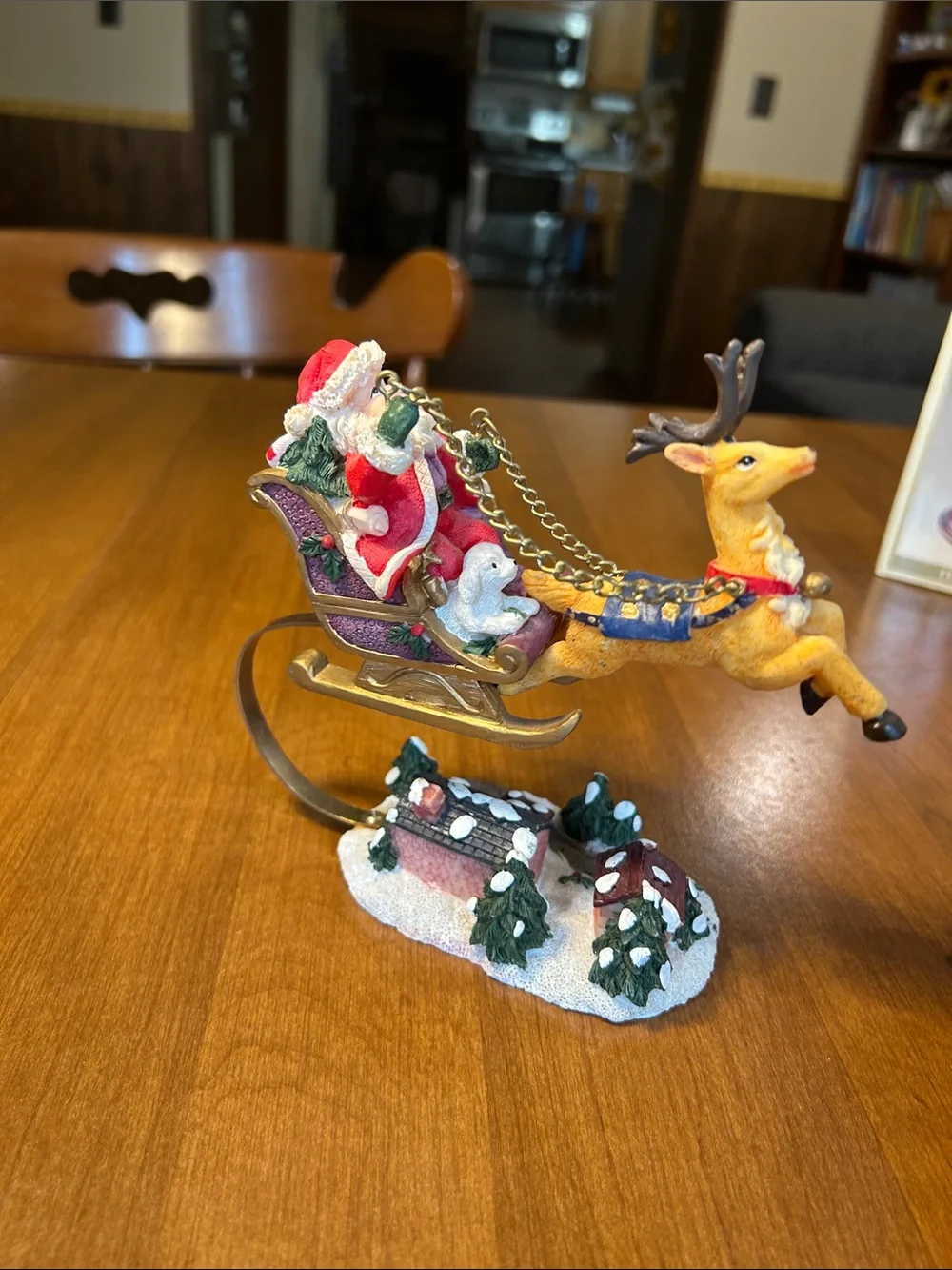 Festive Santa in Red Sleigh with Reindeer Holiday Figurine